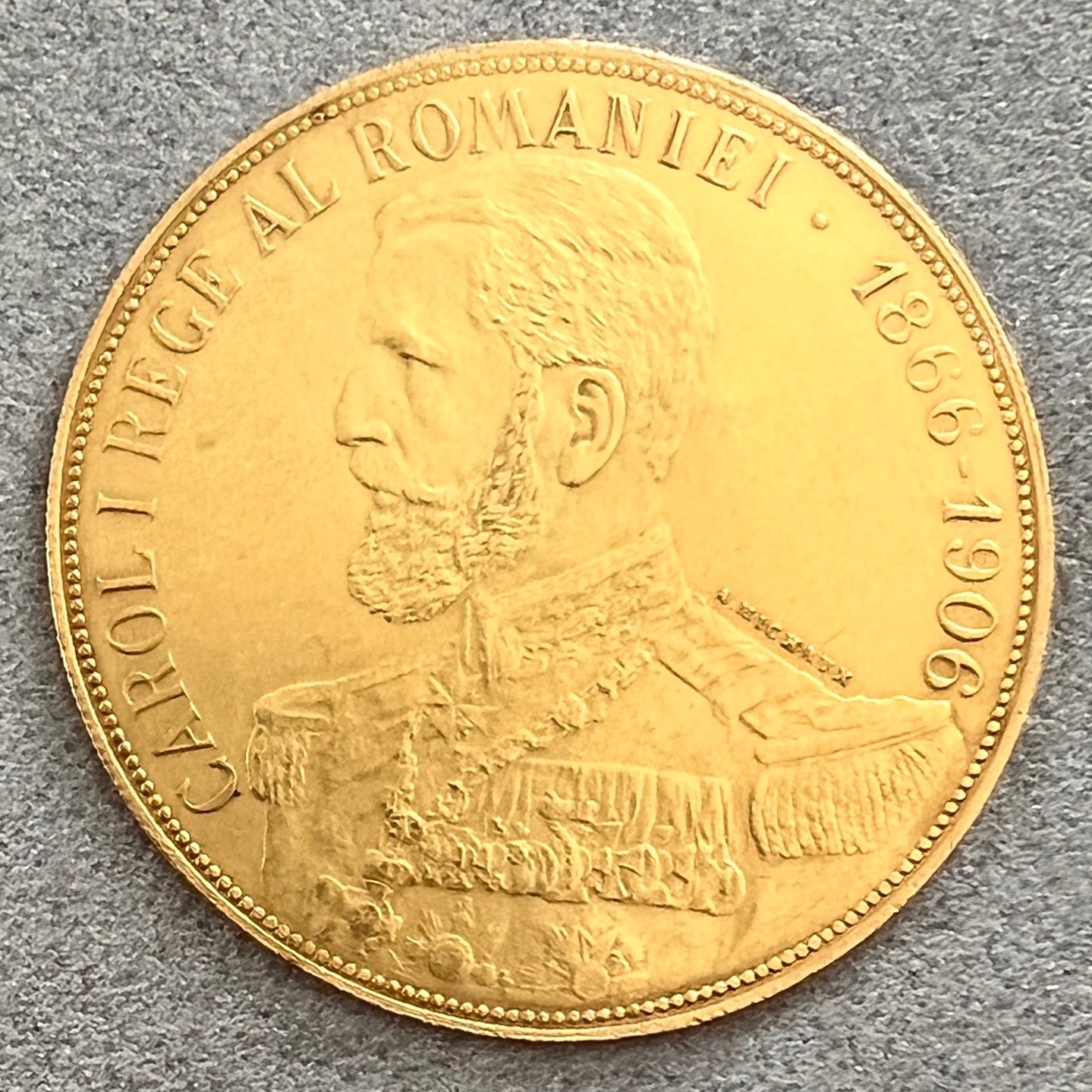 MONEDĂ JUBILIARĂ CAROL I, DIN AUR, CU VALOARE NOMINALĂ DE 50 DE LEI, GRAVOR ALPHONSE MICHAUX, 1906 - Artiss